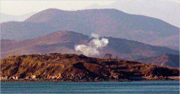 Smoke is seen rising from North Korean territory on Friday, after an explosion was heard and seen from South Korea’s Yeonpyeong island.